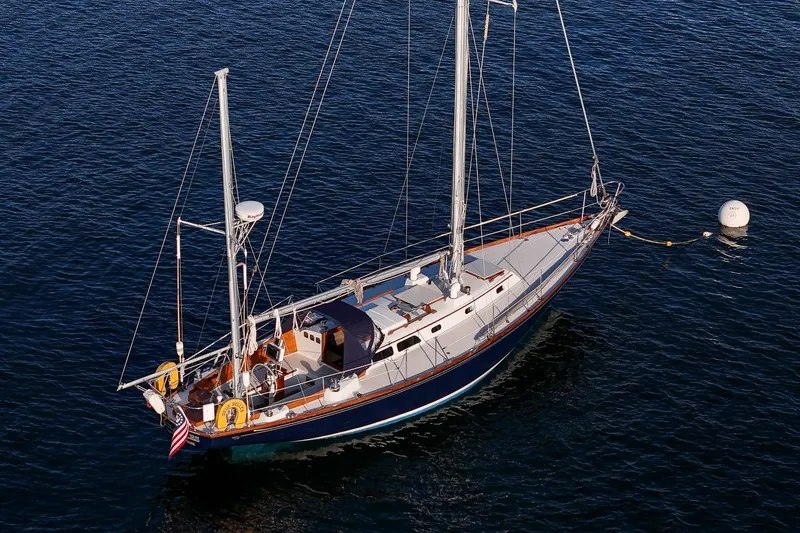 Slide: The Image of 1971 Hinckley Bermuda 40 Custom Yawl sailing on calm waters. - 8
