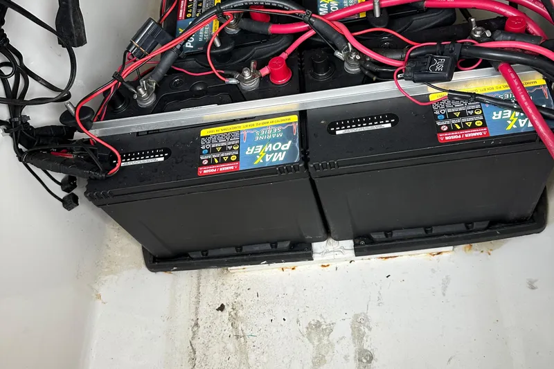 Slide: The Image of Battery setup in a 1999 Jupiter 31 Cuddy boat, featuring Max Power marine batteries. - 43