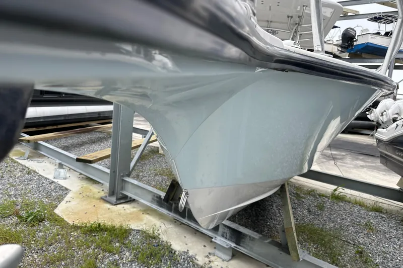 Slide: The Image of 1999 Jupiter 31 Cuddy boat hull on a metal stand, side view. - 46
