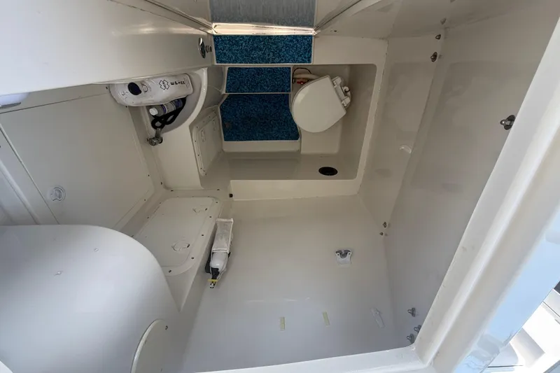 Slide: The Image of 1999 Jupiter 31 Cuddy cabin interior with toilet and storage space. - 6
