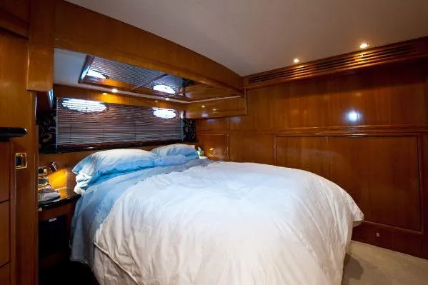 Slide: The Image of Luxurious interior of 2001 Carver 530 Voyager Pilothouse with leather seating and wood accents. - 17