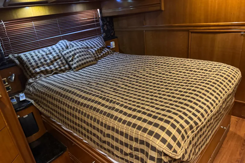 Slide: The Image of Luxurious bedroom interior of 2001 Carver 530 Voyager Pilothouse yacht. - 28