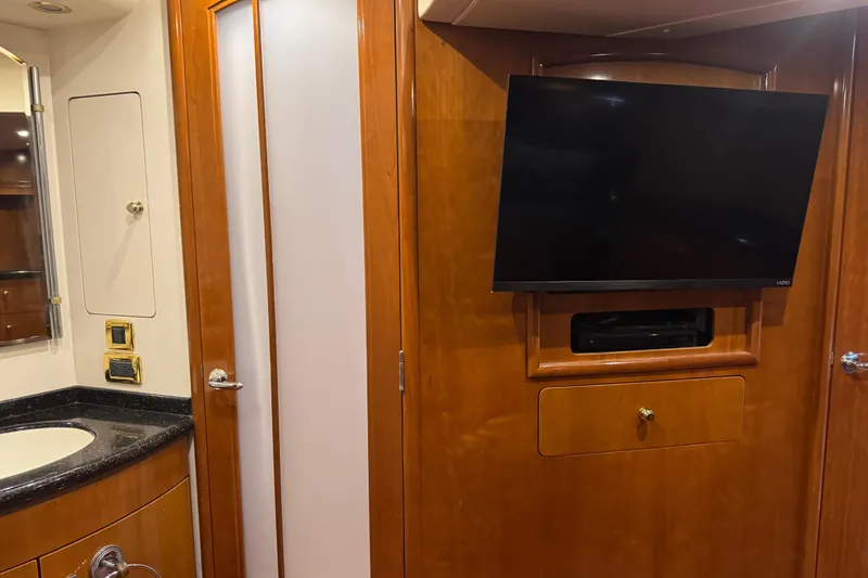 Slide: The Image of Interior of 2001 Carver 530 Voyager Pilothouse with TV and bathroom sink. - 31
