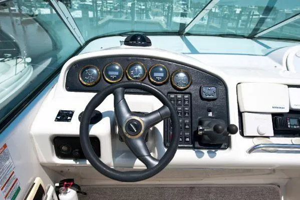 Slide: The Image of 2001 Carver 530 Voyager Pilothouse helm with steering wheel and instrument panel. - 9