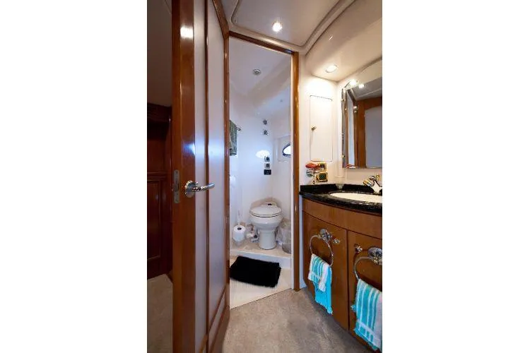 Slide: The Image of Luxurious bathroom in 2001 Carver 530 Voyager Pilothouse yacht with modern amenities. - 14