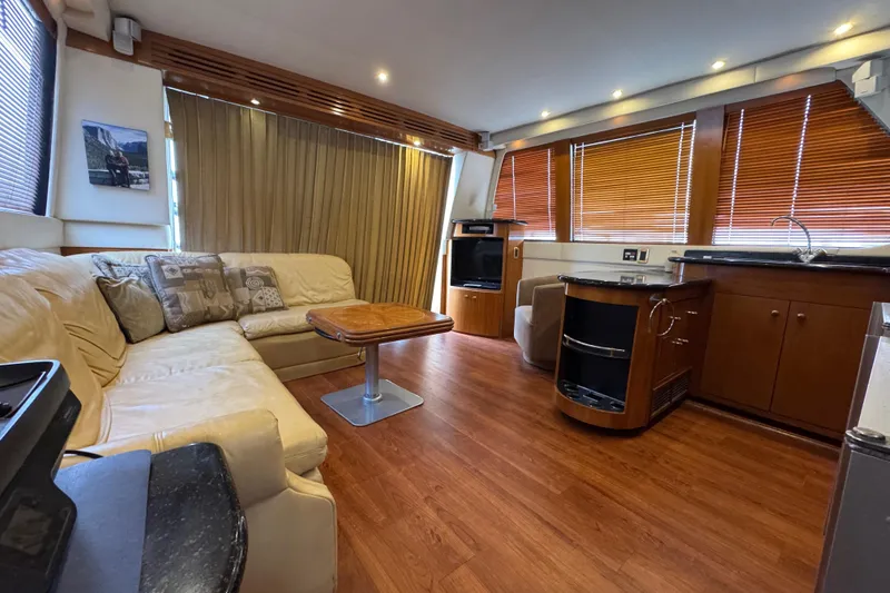 Slide: The Image of Luxurious interior of 2001 Carver 530 Voyager Pilothouse with leather seating and wood accents. - 22