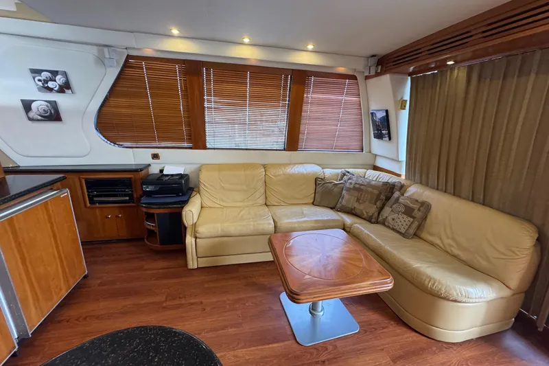Slide: The Image of Luxurious interior of 2001 Carver 530 Voyager Pilothouse with leather seating and wooden accents. - 23