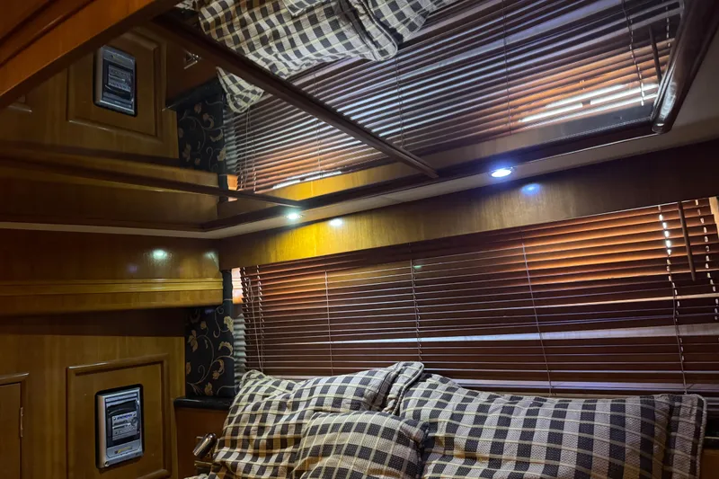Slide: The Image of Interior of 2001 Carver 530 Voyager Pilothouse with wooden blinds and checkered cushions. - 30