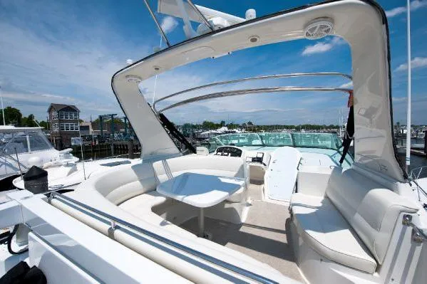 Slide: The Image of 2001 Carver 530 Voyager Pilothouse yacht with spacious seating and elegant design. - 6
