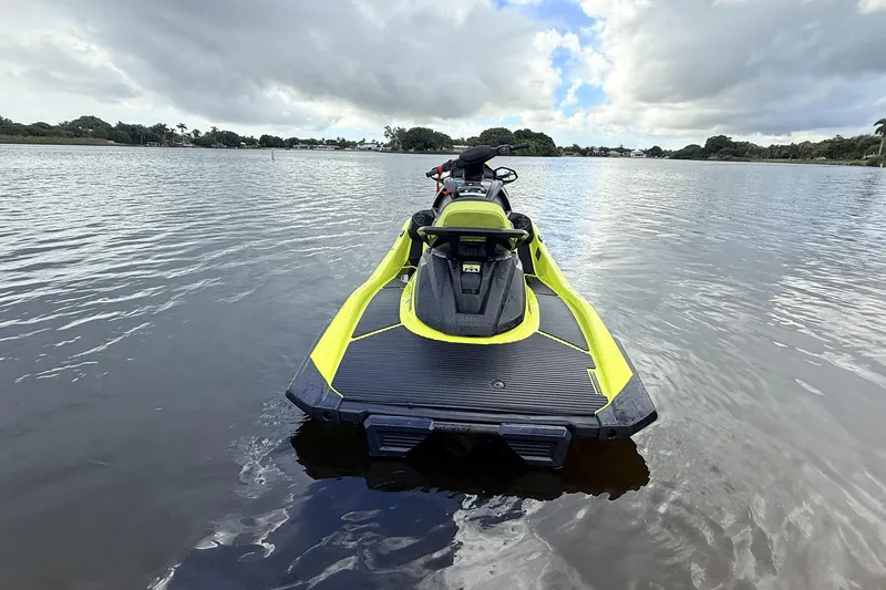 Slide: The Image of 2023 Yamaha WaveRunner VX110 on calm water, showcasing sleek design and vibrant color. - 19