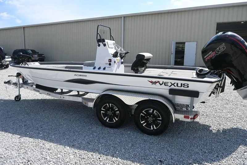 Slide: The Image of 2026 Vexus ACX 2000 boat on trailer, parked outdoors, featuring sleek design and modern engine. - 5