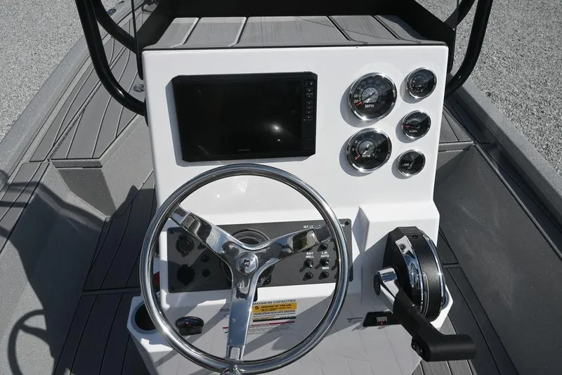 Slide: The Image of 2026 Vexus ACX 2000 boat dashboard with steering wheel and control panel. - 8