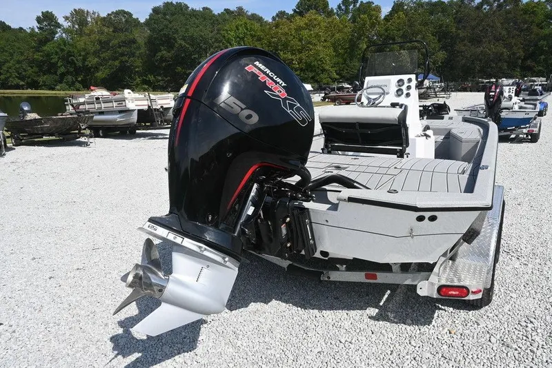Slide: The Image of 2026 Vexus ACX 2000 boat with Mercury 150 Pro XS engine on a gravel lot. - 9