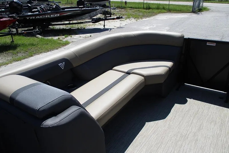 Slide: The Image of Viaggio Lago X22U 2025 boat interior with beige and gray seating, outdoor setting. - 10