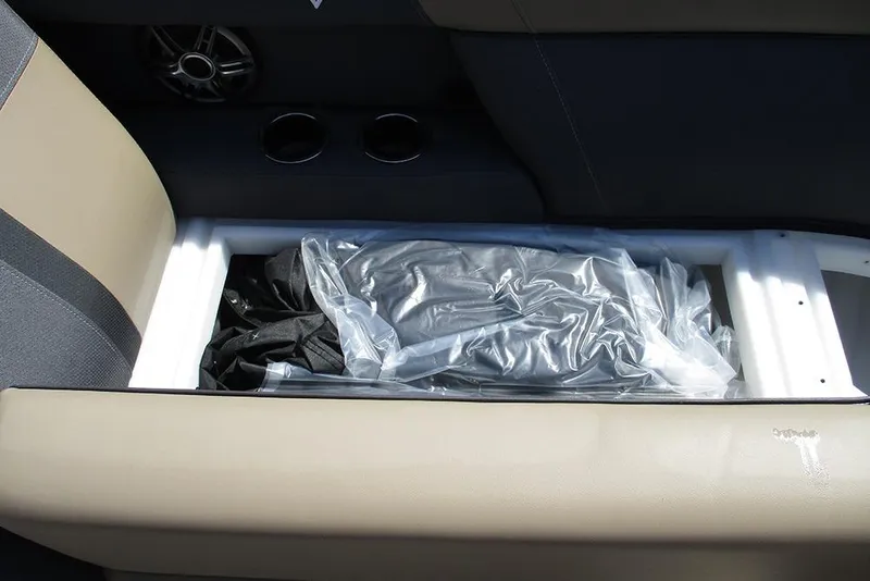 Slide: The Image of Storage compartment in 2025 Viaggio Lago X22U boat, featuring beige and black interior. - 13
