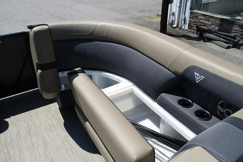 Slide: The Image of 2025 Viaggio Lago X22U boat interior with beige and gray seating, cup holders, and modern design. - 15