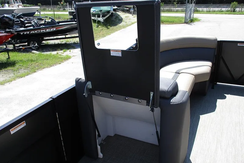 Slide: The Image of 2025 Viaggio Lago X22U pontoon boat interior with seating and storage area. - 20