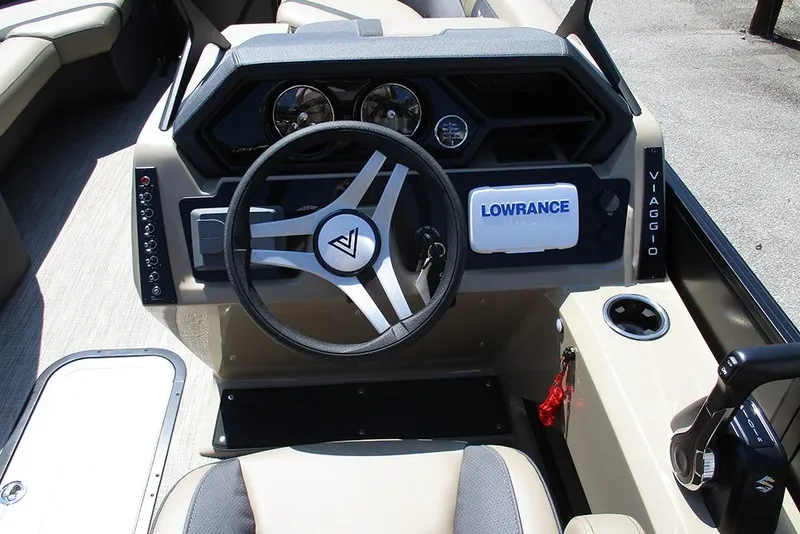 Slide: The Image of 2025 Viaggio Lago X22U boat dashboard with steering wheel and Lowrance system. - 41
