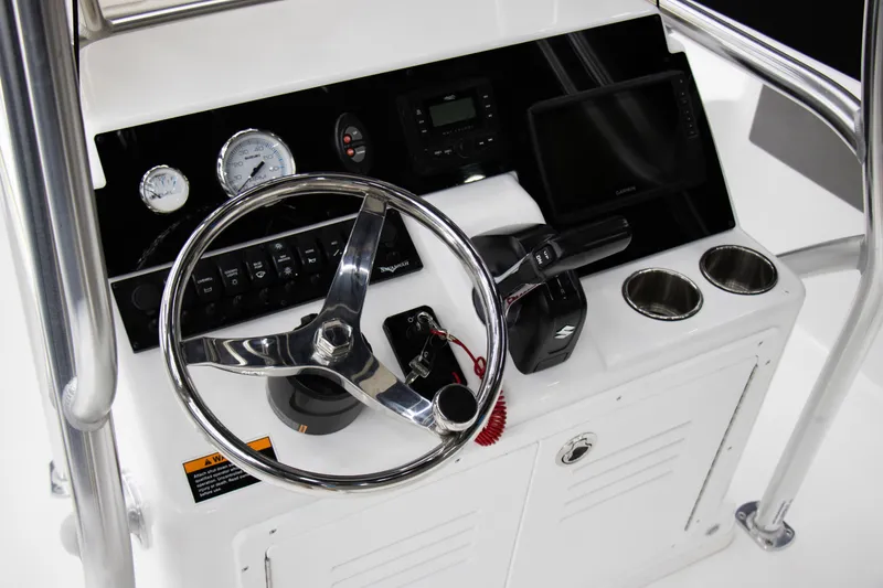 Slide: The Image of Steering console of 2025 Savannah 210X boat with gauges and controls. - 11