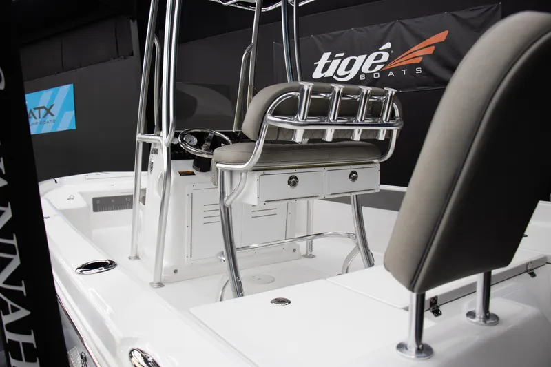 Slide: The Image of 2025 Savannah 210X boat interior with seating and steering console. - 16