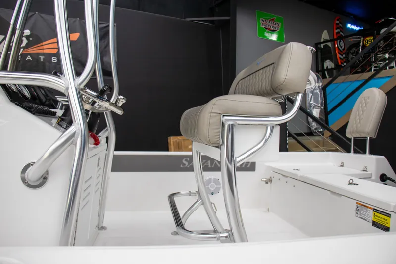 Slide: The Image of 2025 Savannah 210X boat interior with sleek seating and modern steering console. - 6