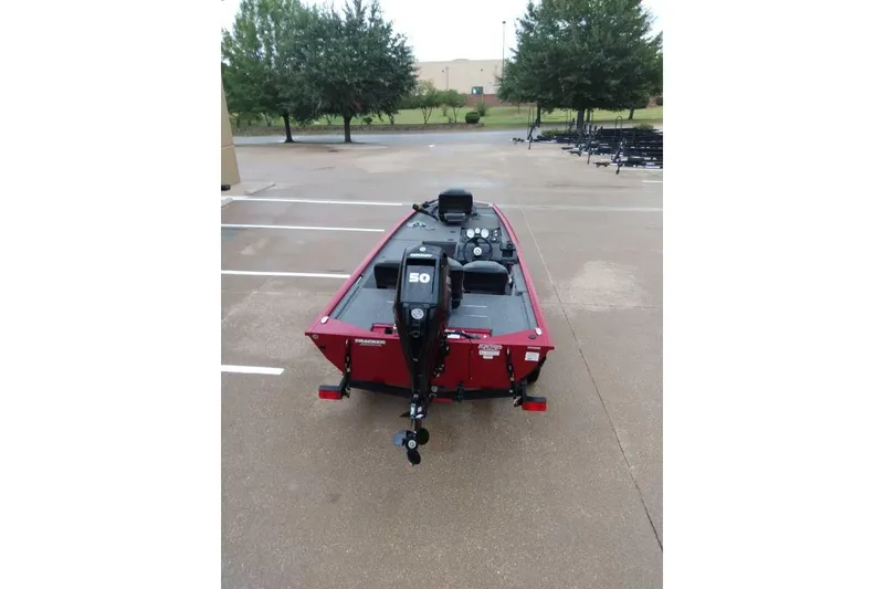 Slide: The Image of 2024 Bass Tracker Pro 170 boat in parking lot, rear view with motor. - 4
