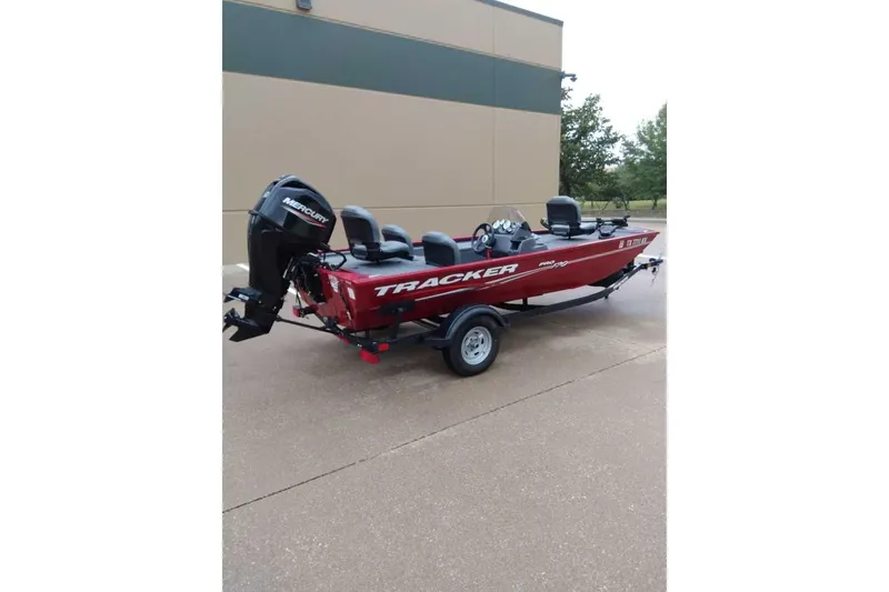 Slide: The Image of 2024 Bass Tracker Pro 170 boat with Mercury engine, parked on a trailer. - 6