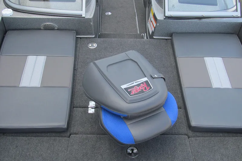 Slide: The Image of 2026 Ranger 212LS boat interior with cushioned seating and swivel chair. - 11