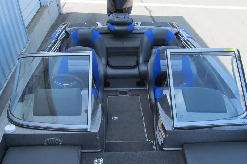 Slide: The Image of 2026 Ranger 212LS boat interior with dual windshields and blue-accented seating. - 12