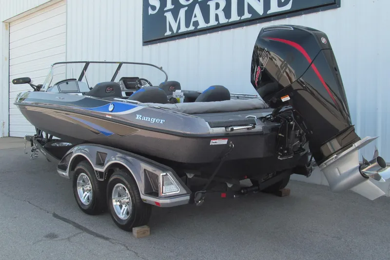 Slide: The Image of 2026 Ranger 212LS boat with powerful outboard motor on a trailer. - 3