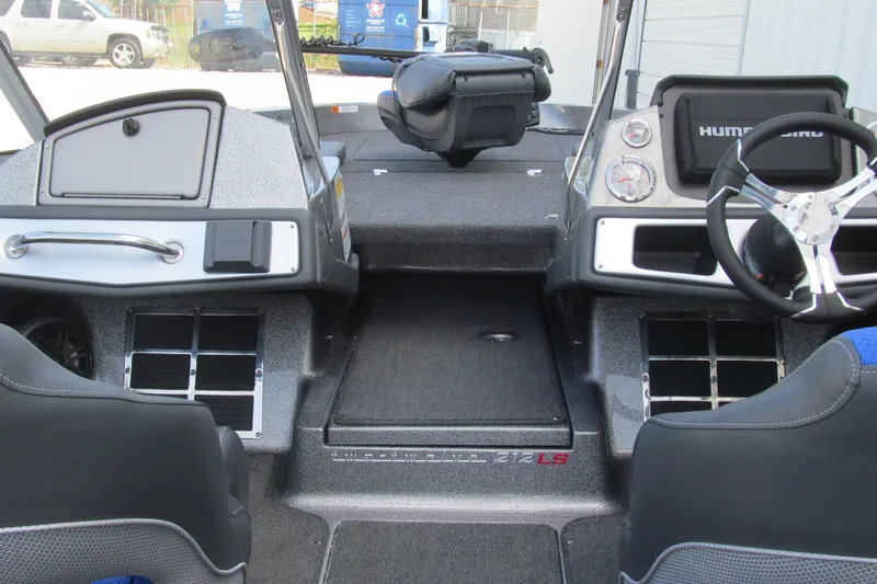 Slide: The Image of Interior of a 2026 Ranger 212LS boat with steering wheel and dashboard controls. - 6