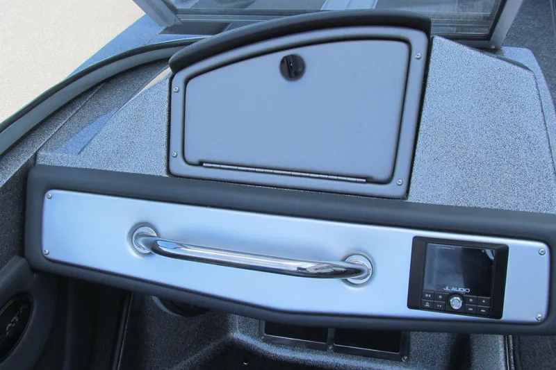 Slide: The Image of 2026 Ranger 212LS boat dashboard with JL Audio system and storage compartment. - 8