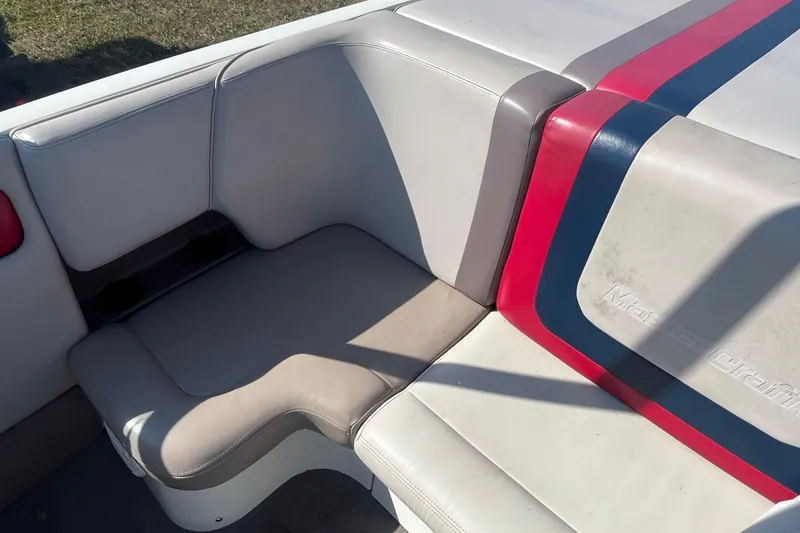 Slide: The Image of 1996 MasterCraft MariStar 210 VRS boat interior with red and blue accents. - 10