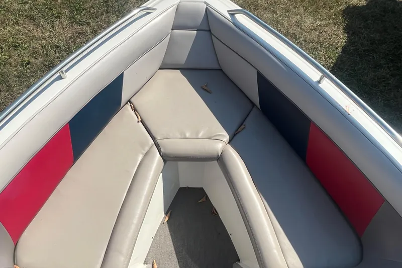 Slide: The Image of 1996 MasterCraft MariStar 210 VRS boat interior with red and blue cushioned seating. - 11