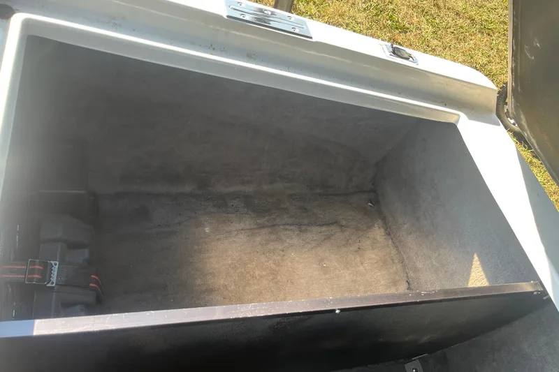 Slide: The Image of Open storage compartment in 1996 MasterCraft MariStar 210 VRS boat, showing interior space. - 16