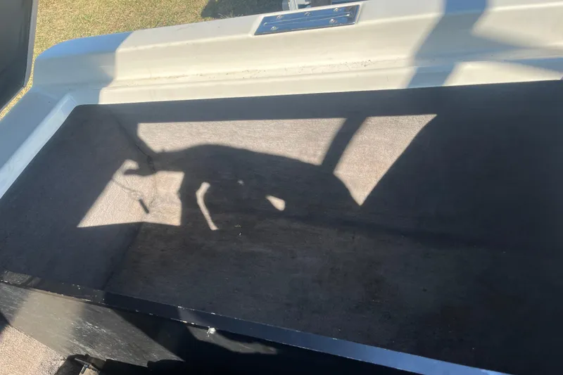 Slide: The Image of Open storage compartment in 1996 MasterCraft MariStar 210 VRS boat, shadow visible. - 17