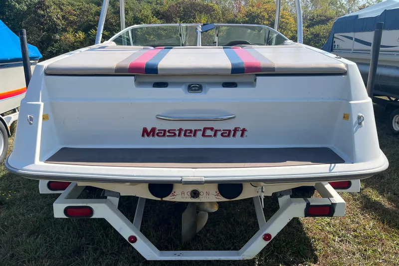 Slide: The Image of 1996 MasterCraft MariStar 210 VRS boat, rear view, parked on grass. - 4