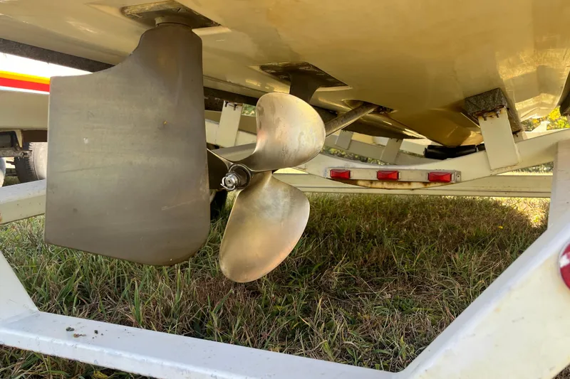 Slide: The Image of 1996 MasterCraft MariStar 210 VRS boat propeller and rudder on trailer. - 5