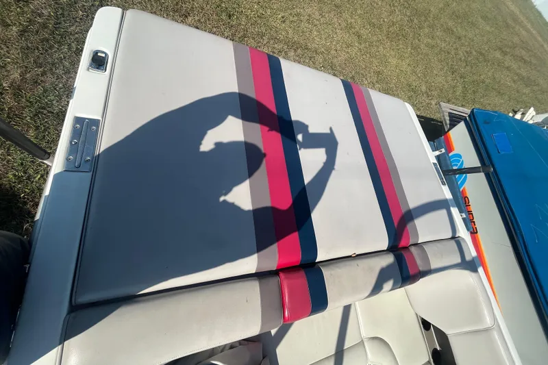 Slide: The Image of 1996 MasterCraft MariStar 210 VRS boat seat with colorful stripes and shadow. - 8