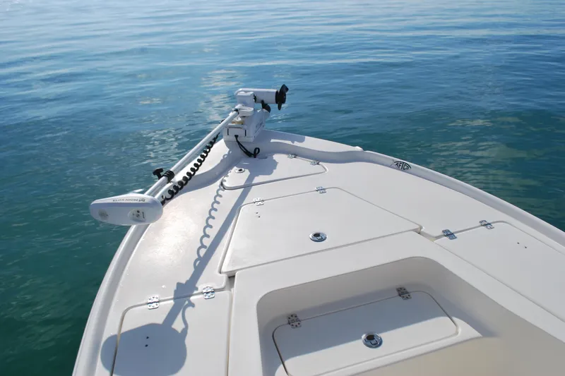 Slide: The Image of 2021 Key West 210 Bay Reef boat deck with trolling motor on calm water. - 6