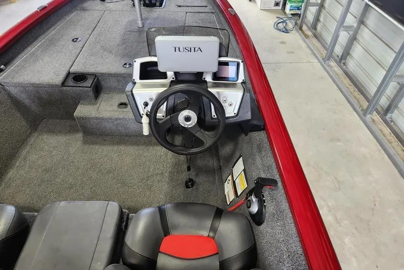 Slide: The Image of 2025 Tracker Pro Team 175 boat interior with steering wheel and control panel. - 6