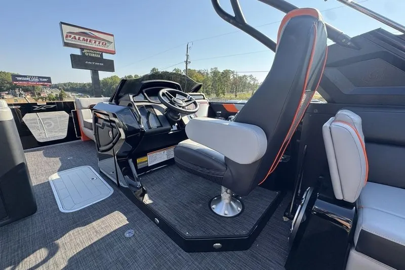 Slide: The Image of Interior of 2026 Godfrey XP 2700 TWIN boat with modern helm and seating. - 13