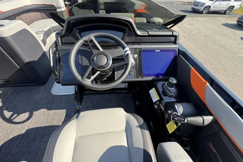 Slide: The Image of Interior view of 2026 Godfrey XP 2700 TWIN boat cockpit with steering wheel and controls. - 18