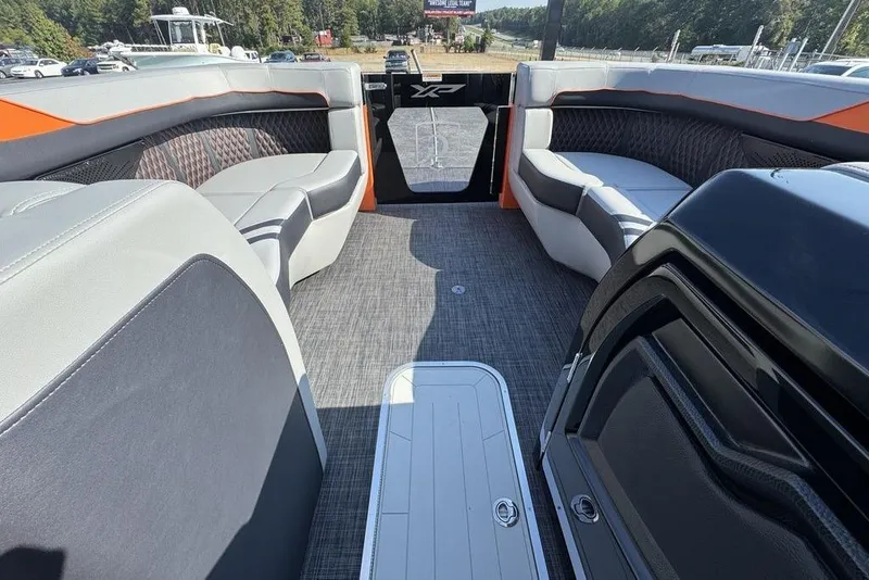 Slide: The Image of Interior of 2026 Godfrey XP 2700 TWIN boat with spacious seating and modern design. - 29