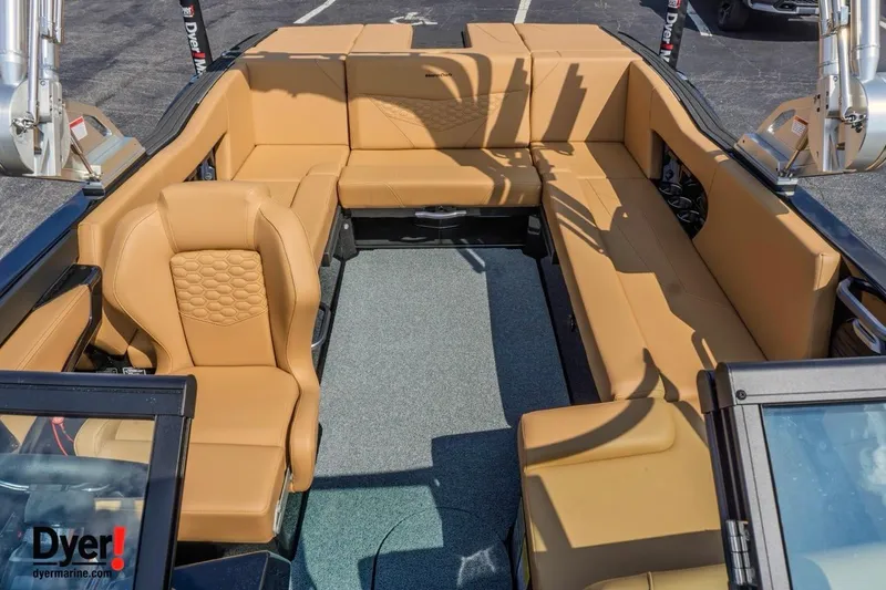 Slide: The Image of 2026 MasterCraft NXT22 boat interior with tan seating and modern design. - 13