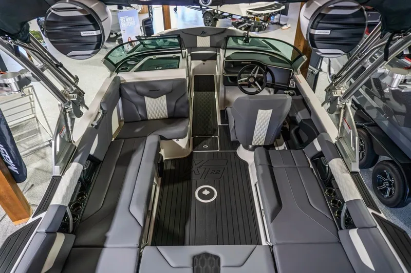 Slide: The Image of 2026 MasterCraft XT22 boat interior with sleek seating and modern dashboard design. - 3
