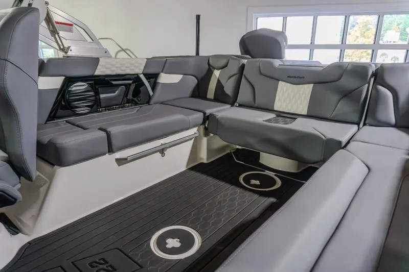 Slide: The Image of 2026 MasterCraft XT22 interior with sleek gray seating and modern design elements. - 5