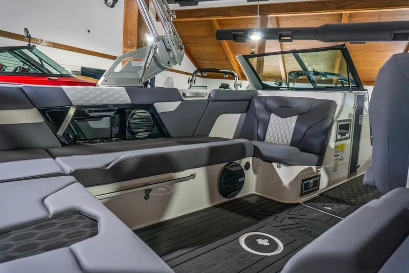 Slide: The Image of 2026 MasterCraft XT22 boat interior with luxurious seating and modern design features. - 6