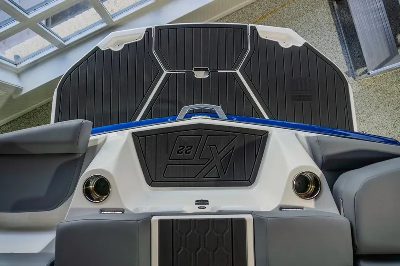 Slide: The Image of 2026 MasterCraft XT22 boat interior with sleek black and gray design. - 9