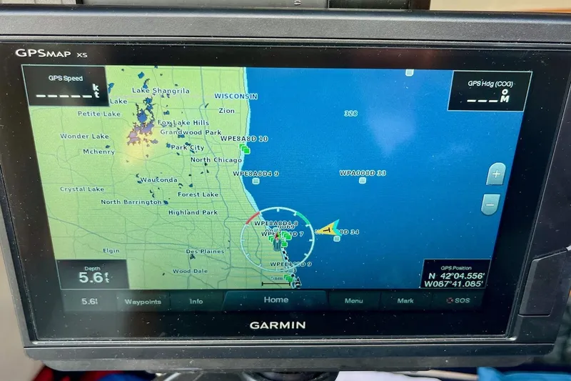 Slide: The Image of Garmin GPS display on Alerion Express 28 sailboat, showing navigation map and coordinates. - 10